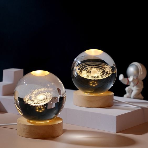 84fdbc0736b653c583b71c0556846e85 Beautiful 3D Crystal Ball LED Table Lamp With Laser Engraved Solar System Or Galaxy Design On Wooden Base (Random Design)